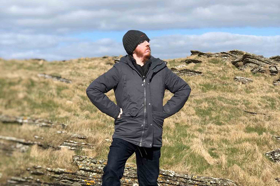 Stephen Morrison posing on rocks